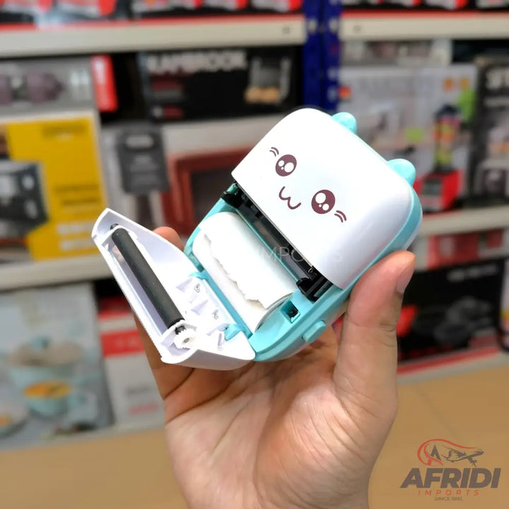 A cute, light blue and white portable thermal printer with a roll of paper visible inside.