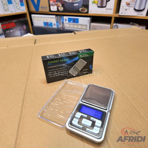 A digital pocket scale with a clear protective cover.