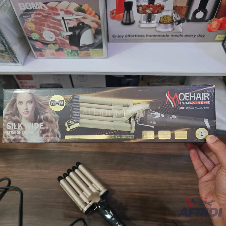 Boxed ’Moehair Pro Extreme’ silk wide straight hair waver iron, with a similar unboxed iron below it.