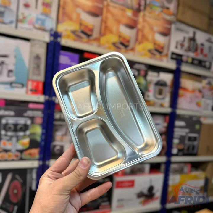 Three-compartment stainless steel food tray.