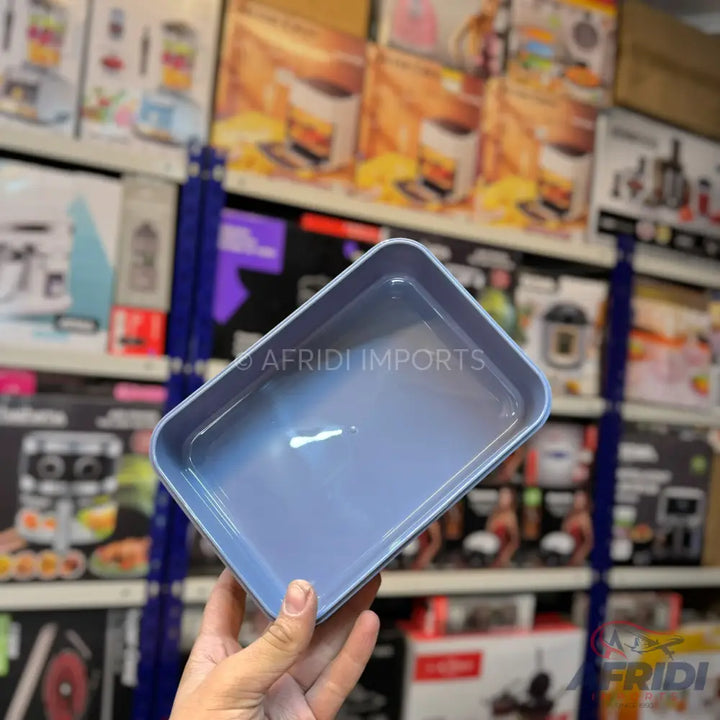 A rectangular, light blue baking dish with rounded corners.