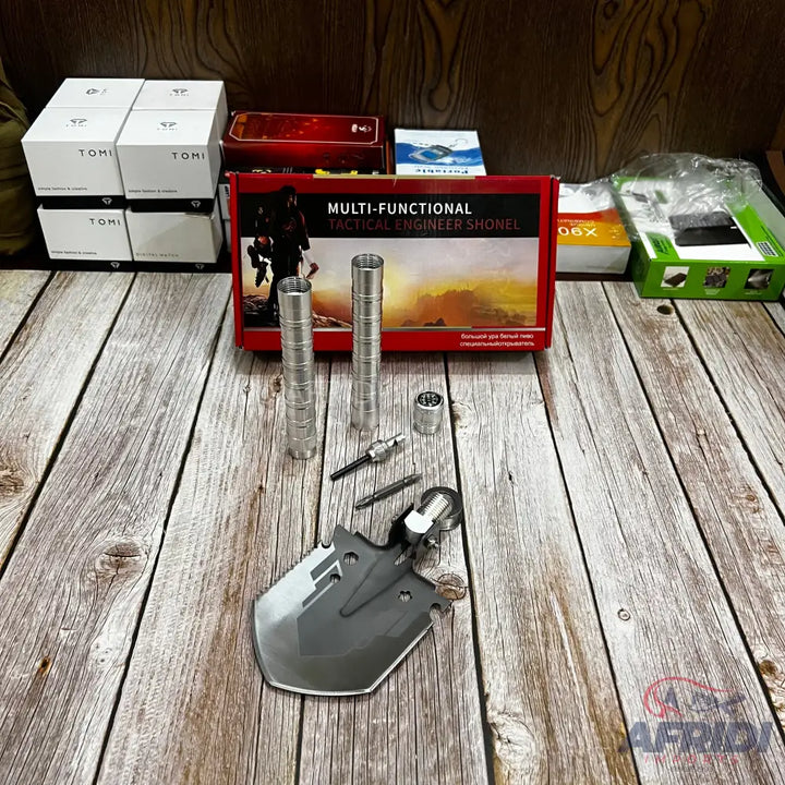 A disassembled, multi-functional tactical engineer shovel.