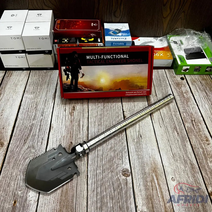 A multi-functional tactical engineer shovel with a silver handle and dark gray head.