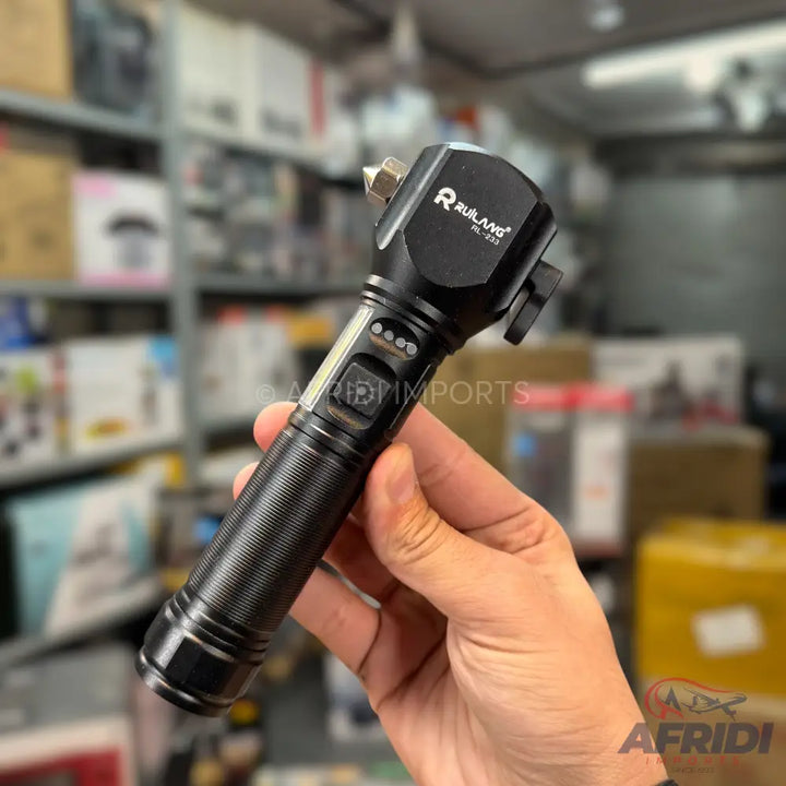 Black tactical flashlight with a pointed end for breaking glass, a side-mounted light, and a battery indicator.