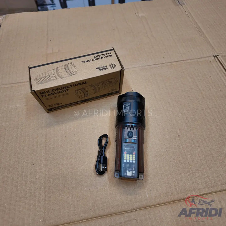 A brown and black multifunctional flashlight with a charging cable.
