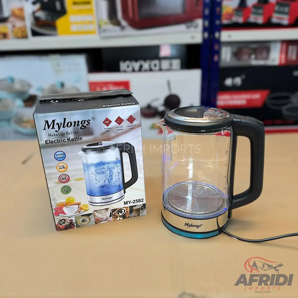 A clear glass electric kettle with a black handle and a blue-silver base.