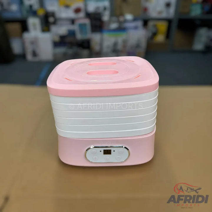 Pink and white multi-tiered food dehydrator with a digital control panel.