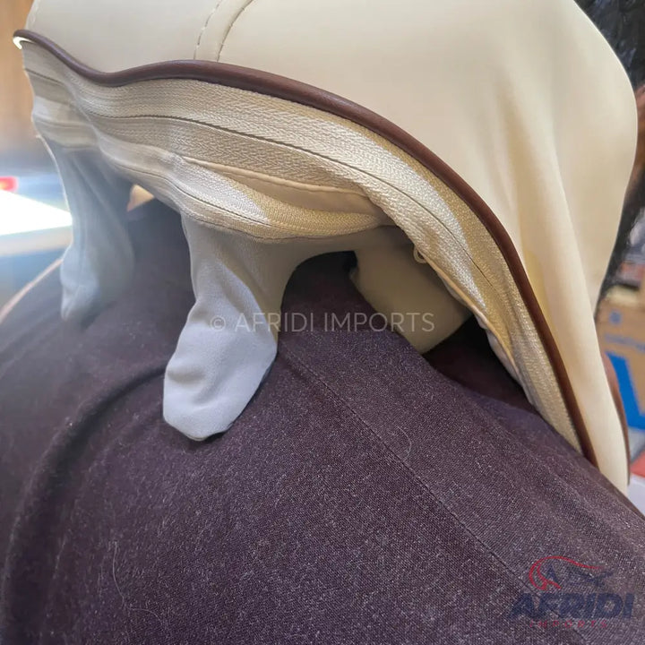 A light-colored garment with a brown trim and a white lining.