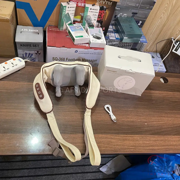 Beige U-shaped neck and shoulder massager with control buttons.