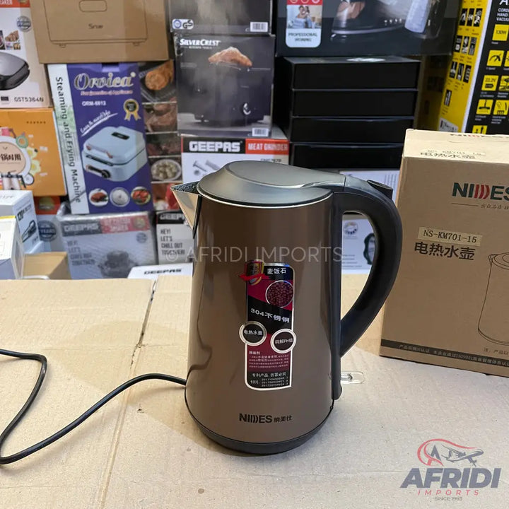 Brown electric kettle with a black handle.