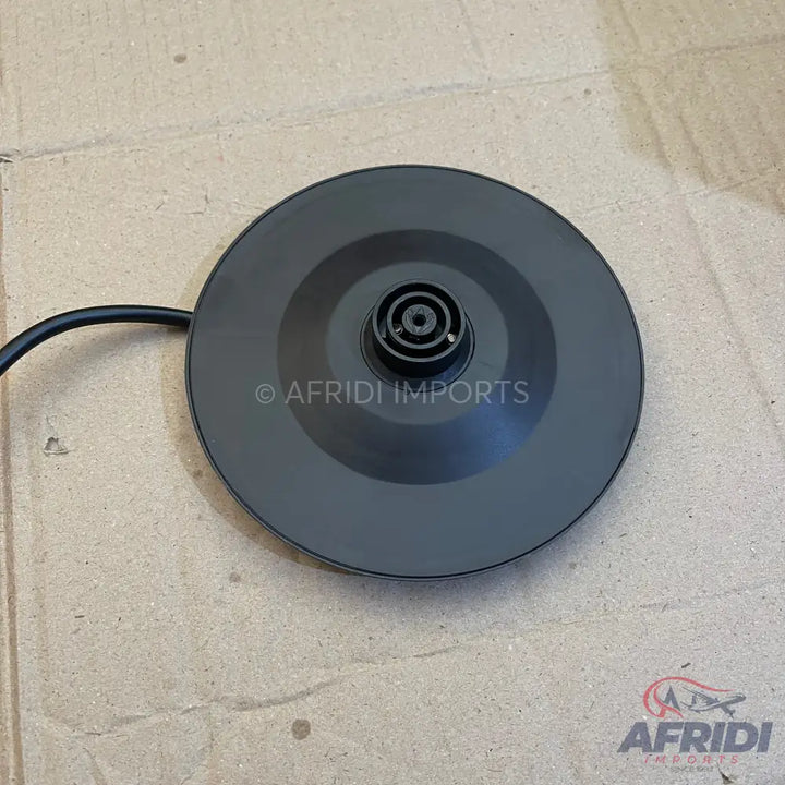 Black circular electric kettle base with a central power connector.