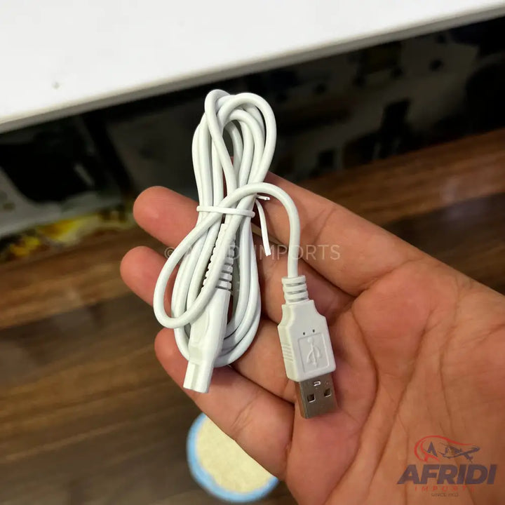 White USB charging cable with a two-prong connector.