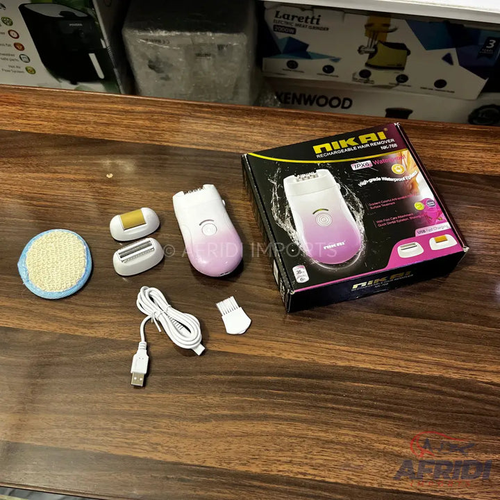 A pink and white rechargeable hair remover with multiple attachments and a charging cable.