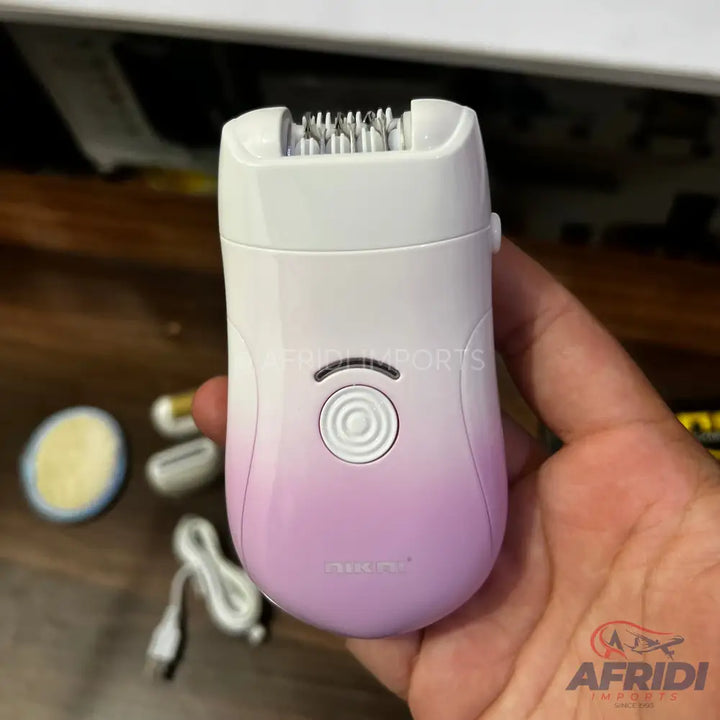 White and purple gradient electric epilator with multiple tweezers, a power button, and an indicator light.
