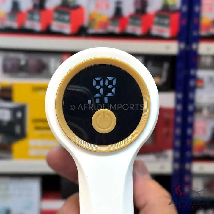 White handheld device with a round digital display showing ’99’’ and a golden power button.