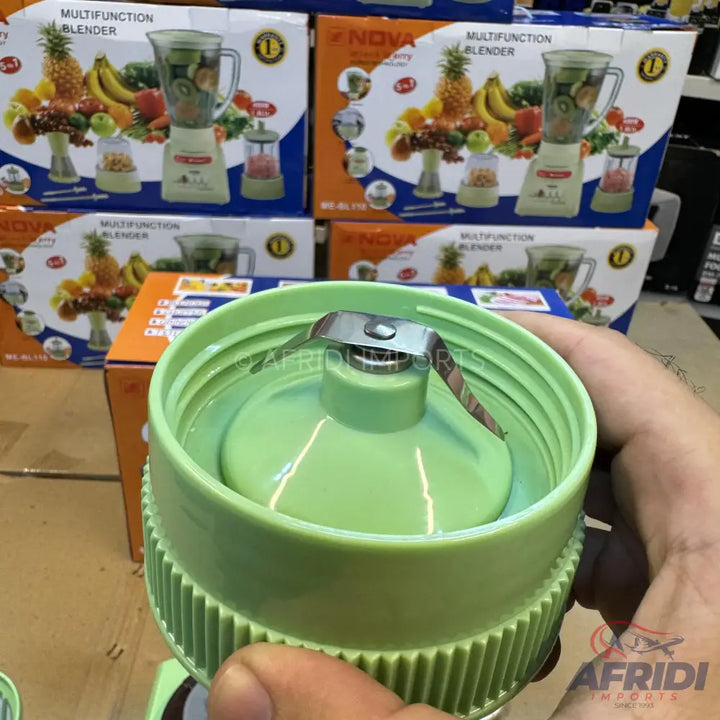 A light green blender blade assembly with a ribbed base.