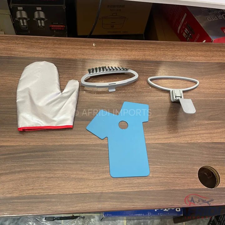 A set of garment steamer accessories including a mitt, brush, collar press, and a measuring tool.