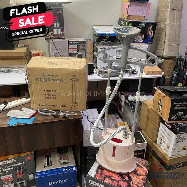 A light-colored garment steamer with a flexible hose and a hanger attachment.