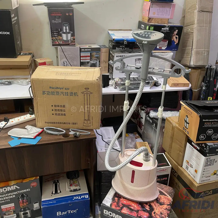 A cream and gray garment steamer with an adjustable stand and hose.