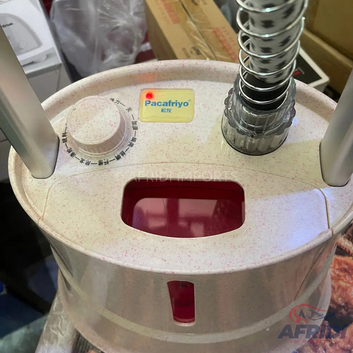 A white and beige garment steamer with a red water tank and a control knob.