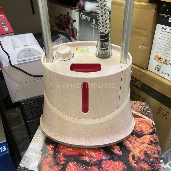 Cream-colored garment steamer with a visible red water tank.
