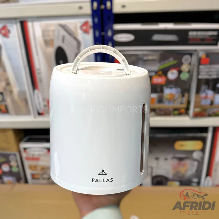White portable humidifier with a top handle and a visible water level indicator.