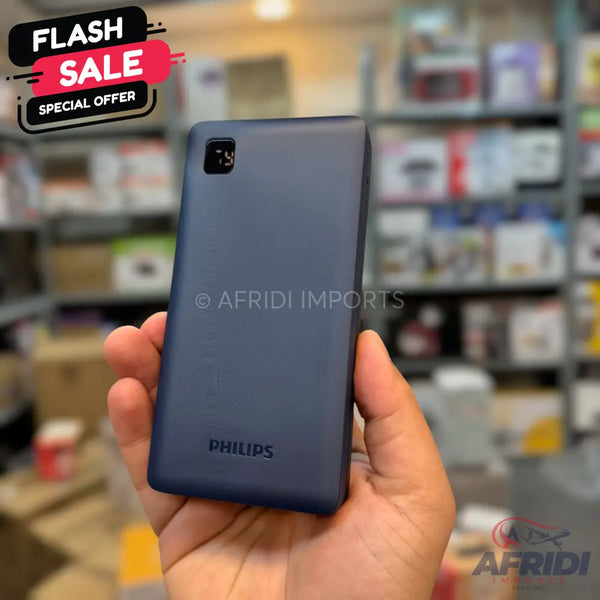 Dark blue portable power bank with a digital display.