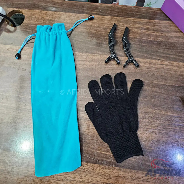 A turquoise drawstring pouch with a pair of black hair clips and a black heat-resistant glove.