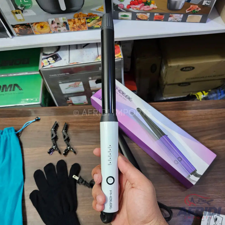 White and black hair curling wand with temperature settings.