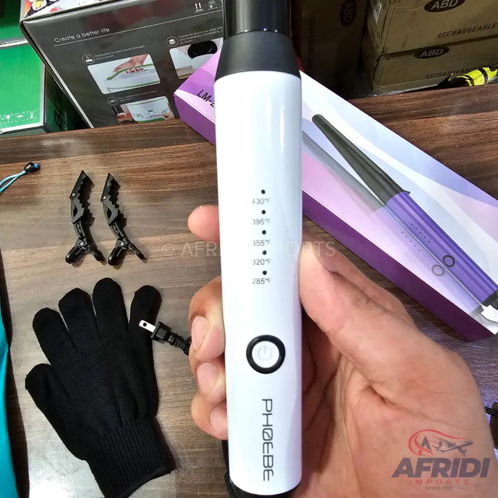 White, portable hair styling tool with adjustable temperature settings.
