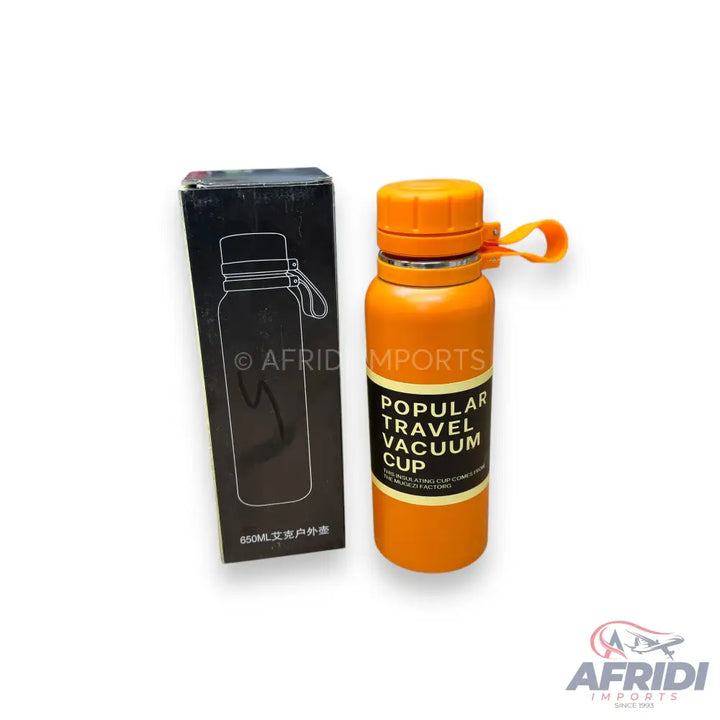 Orange travel vacuum cup with a black box.