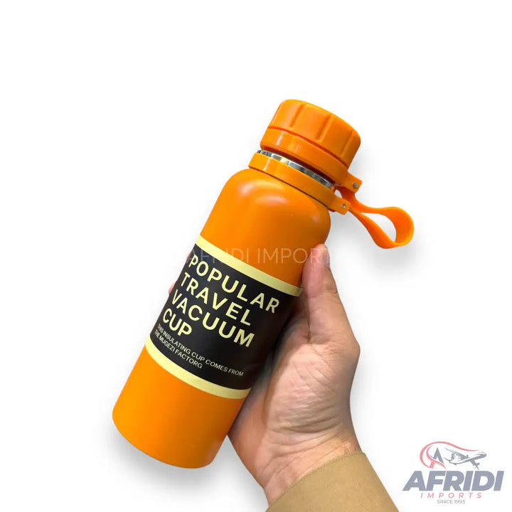 Orange vacuum-insulated water bottle with a screw-top lid and a carrying loop.