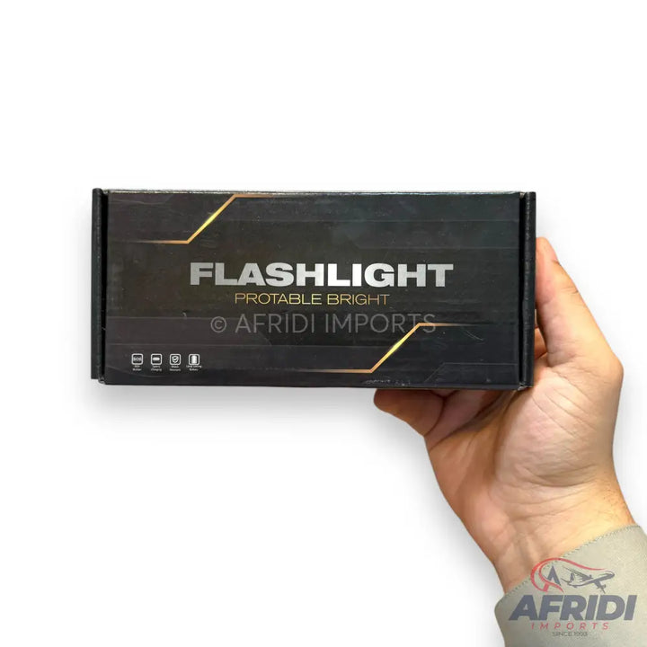 Black box packaging for a flashlight.