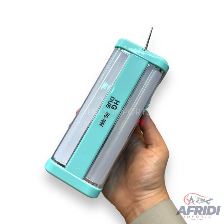 Light blue and white rechargeable LED emergency light held in a hand.