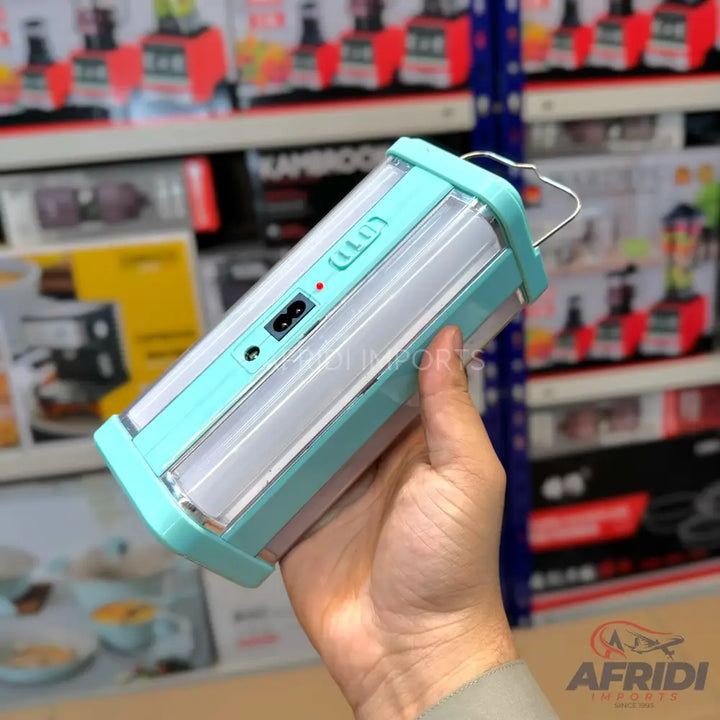 Light blue and white rechargeable LED lantern with a carrying handle.