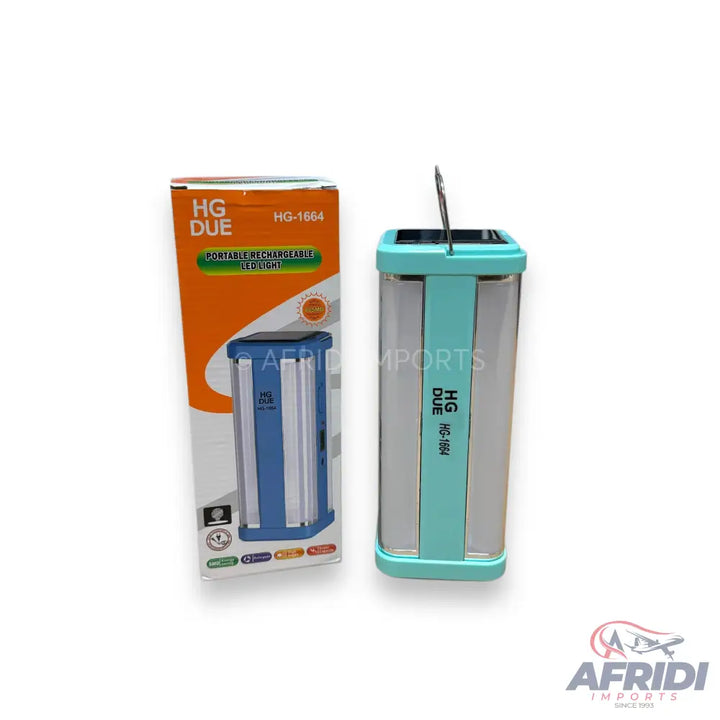 A portable, rechargeable, turquoise and silver camping lantern with a solar panel on top, packaged in an orange and white box.