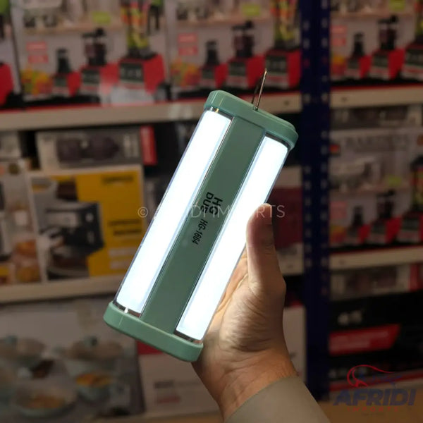 A handheld, light green, rectangular LED light with two bright white light panels.