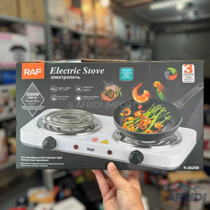 A white, two-burner electric stove with exposed coil heating elements and individual control knobs.