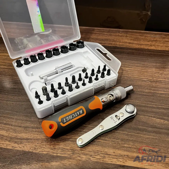 A screwdriver set with various bits and a ratchet handle.