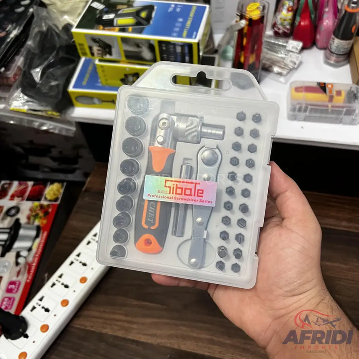 A clear plastic case containing a screwdriver and socket set.