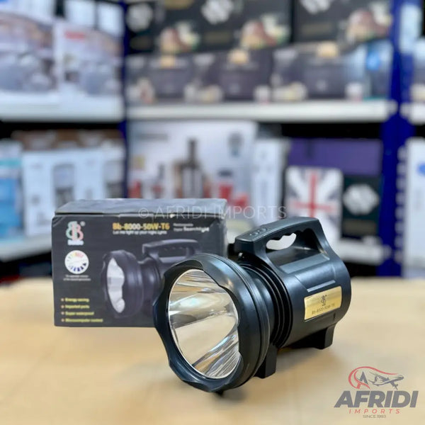 Black, high-power, rechargeable LED searchlight with a comfortable handle for portability.