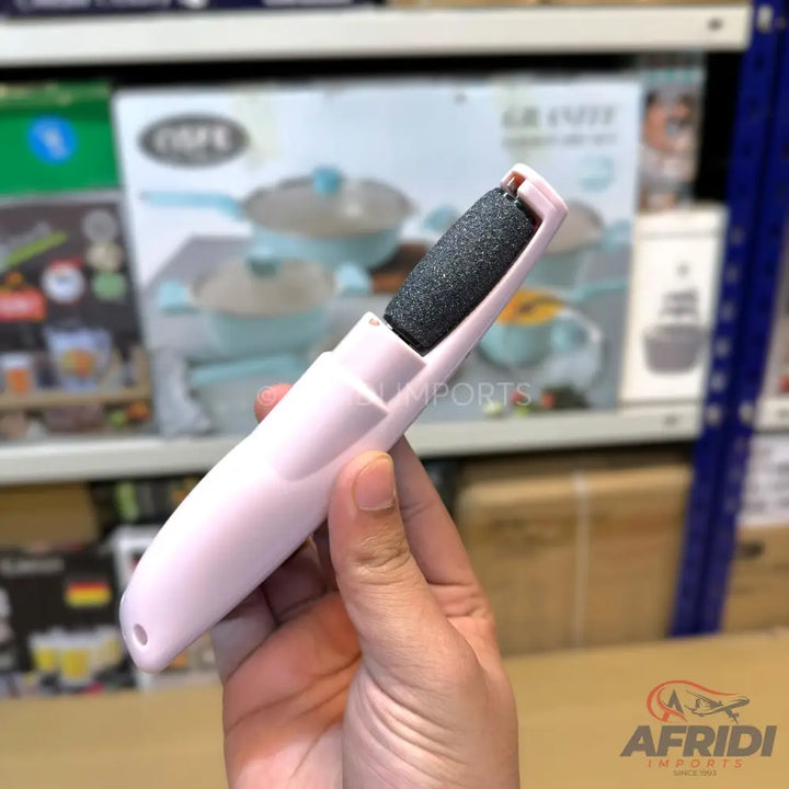 A pink electric foot file with a dark grey abrasive roller.