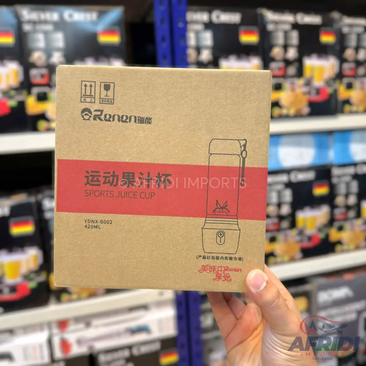 A portable sports juice cup blender in its cardboard packaging.