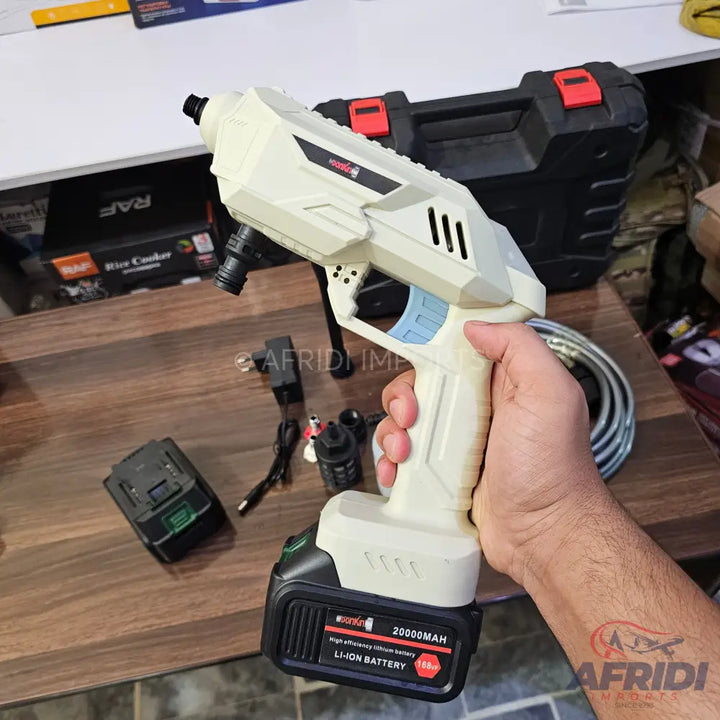 A cordless portable pressure washer with an attached rechargeable lithium-ion battery.