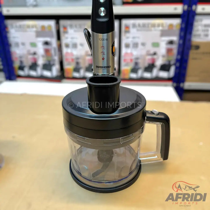 Black and clear food processor with a detachable immersion blender.