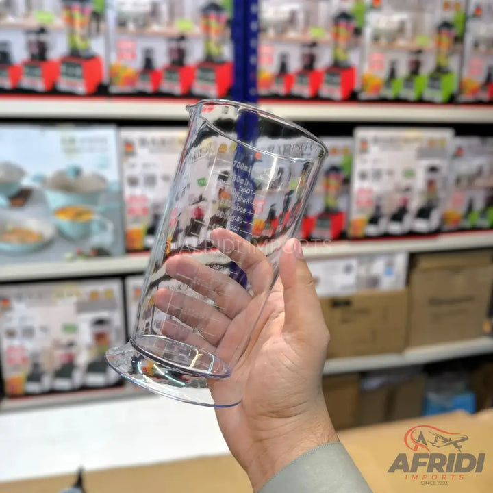 A clear plastic measuring cup with marked volume increments.