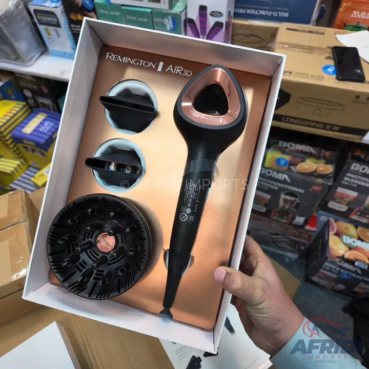Black and copper Remington AIR3D hair dryer with two concentrator nozzles and a diffuser.