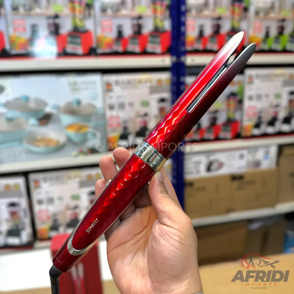 Red metallic hair straightener with a textured grip.