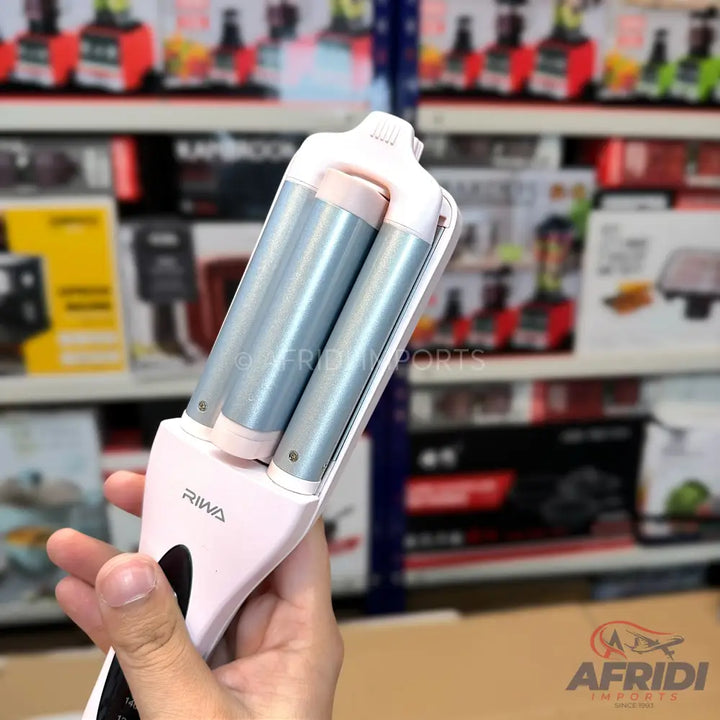 Pink triple-barrel hair waver with light blue heating elements.