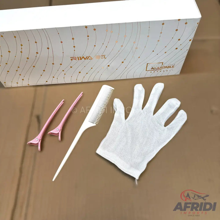 White box with golden wavy lines and dots, containing hair styling accessories.